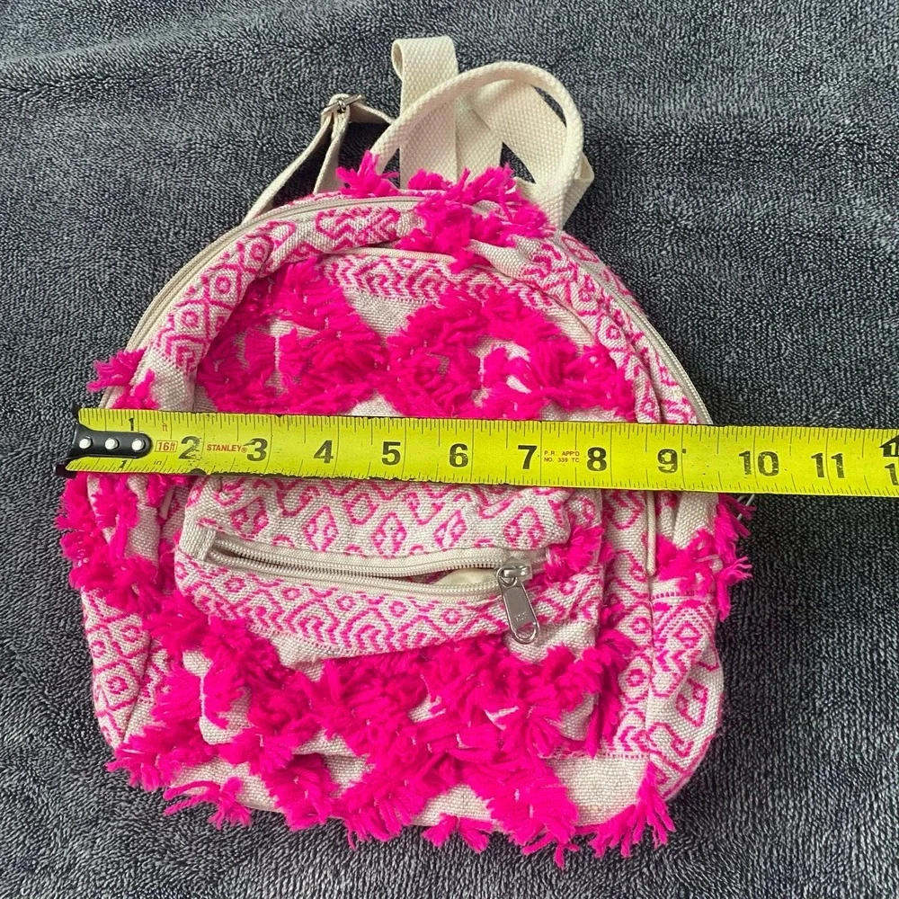 Boho fringe mini backpack‎ in neon pink and coral canvas.
